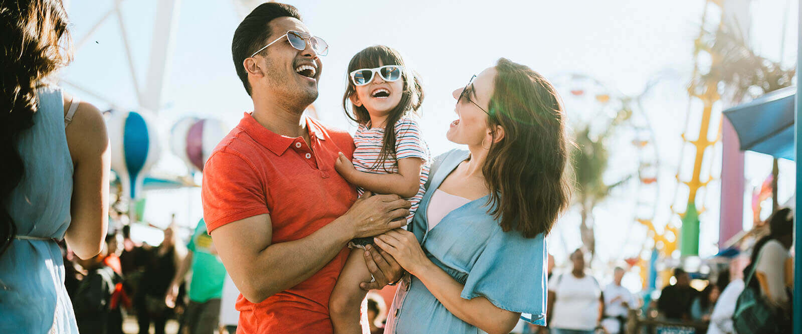 A young military family enjoying a sunny day together.