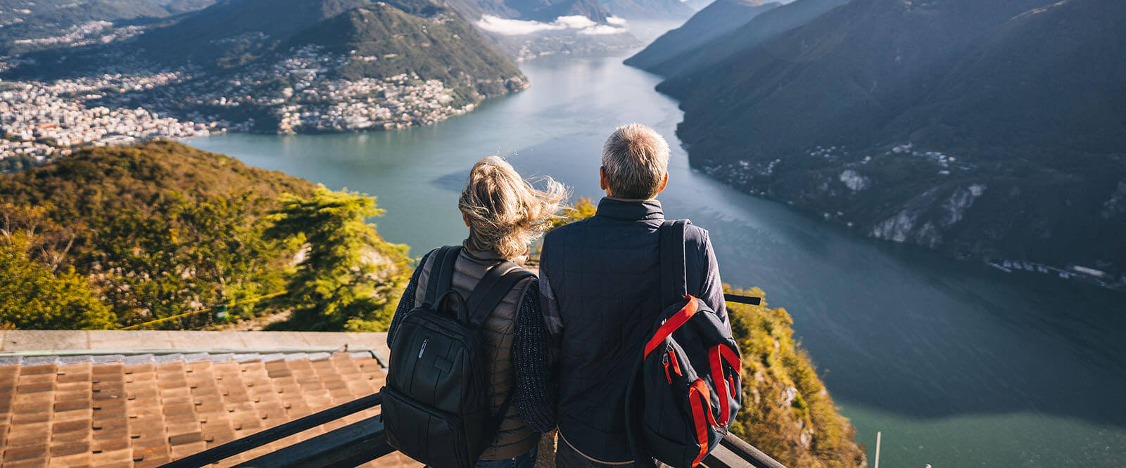 A veteran and his wife looking out over a river on a European holiday.