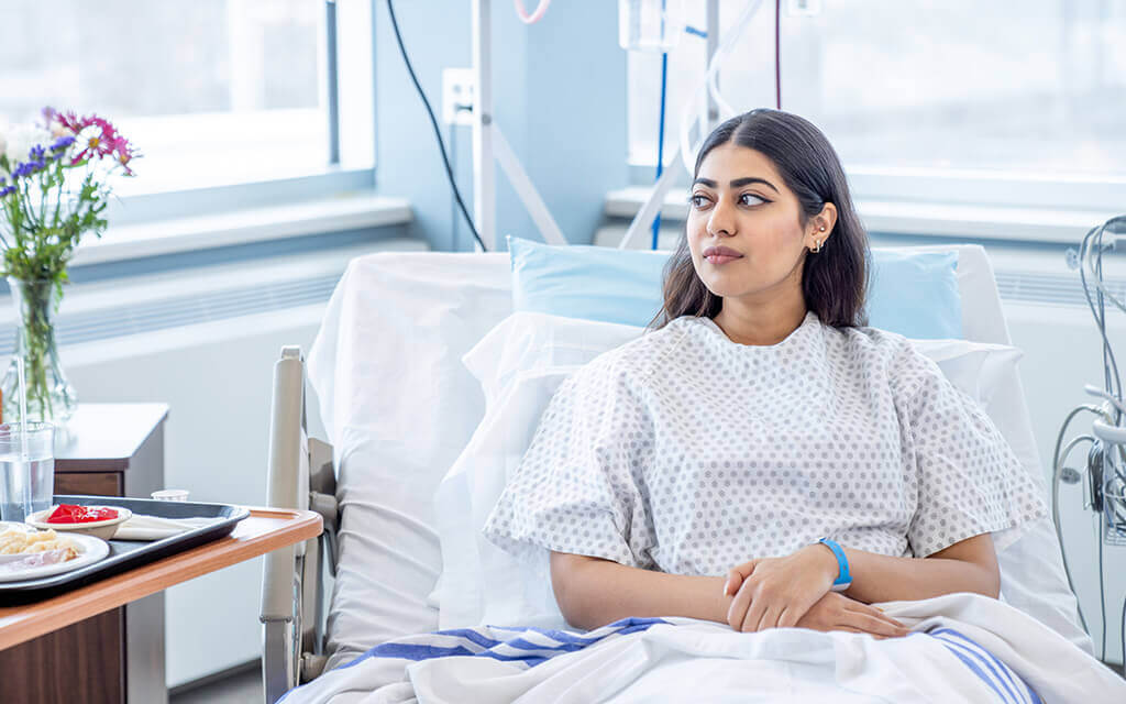 A woman laying in a hospital bed