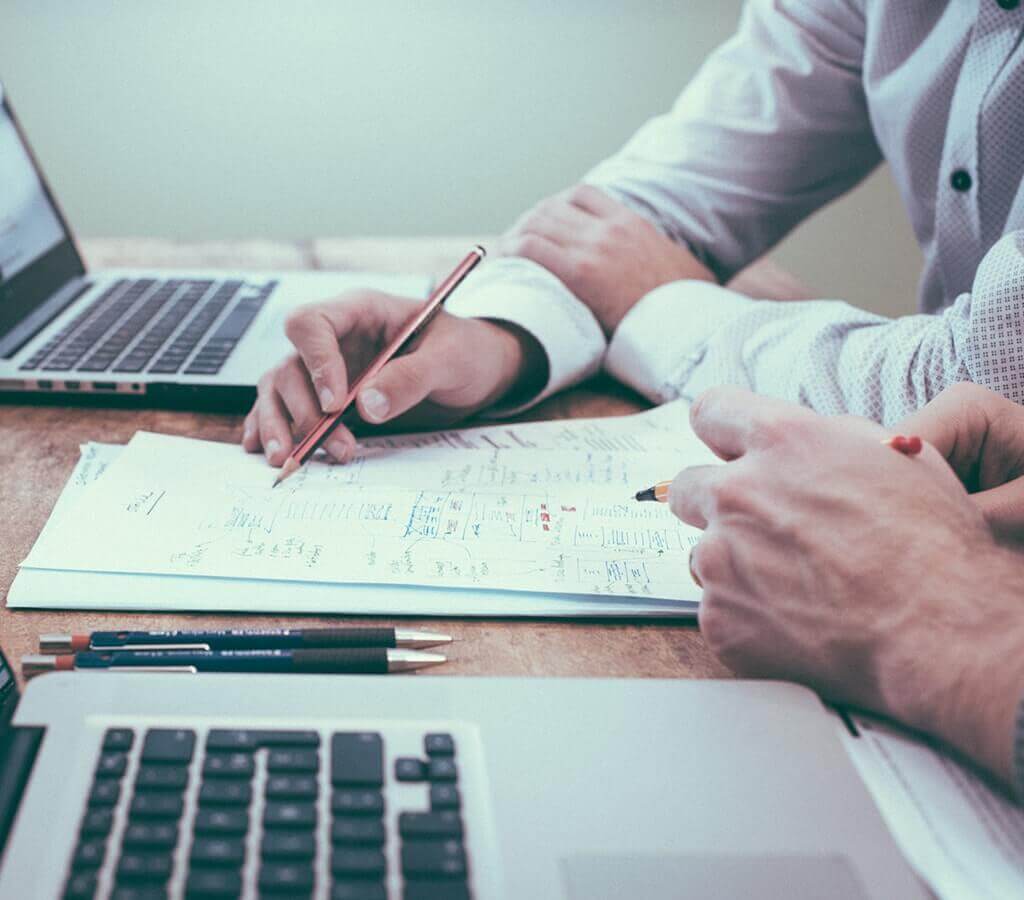 Picture of people reviewing financial documents.